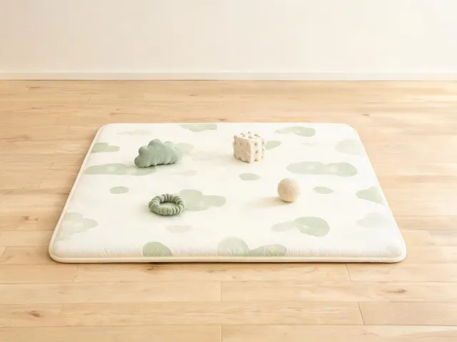 Soft baby play mat on clean floor